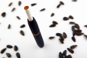electronic smoke device white background sunflowers seeds nobody 