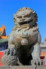 copper lions in a temple