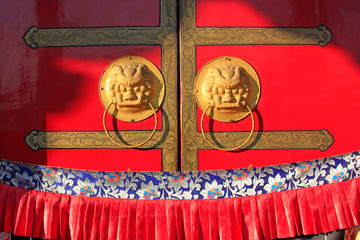 Copper rings on door plank in a temple