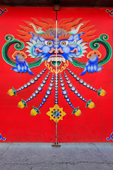 Color design on the red door plank in a temple