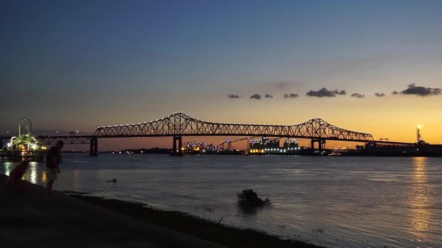 Taking photos from the Baton Rouge levee at dusk while enjoying the sunset