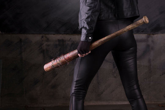 Sexy female assassin with a bat