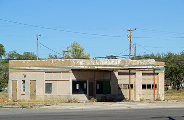 Fototapeta na wymiar An Old Dilapidated Abandoned Car Service Garage Station