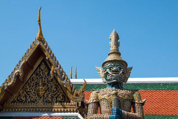 the giant in Temple of the Emerald Buddha (Wat pha kaew) with blue sky.