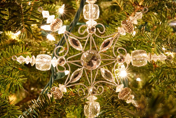 A closeup of a snowflake Christmas ornament. 