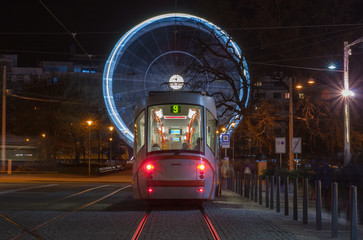 Tram and christmas ferris wheel  at Moravian square in Brno - obrazy, fototapety, plakaty