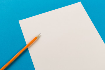 Pencils with  white paper sheets on coloured backgroung, Office tool