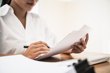 Document Report business busy Concept: Asian Young Businesswoman or University Student reading...