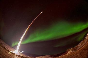 Missile launch at night with aurora polaris. Fish eye lens. The elements of this image furnished by...