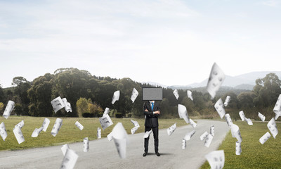 Businessman with TV instead of head.