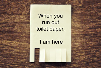 Obraz premium paper notice for tear on wood wall can help when running out of toilet paper
