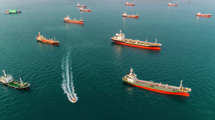 Aerial view Oil ship tanker park in the sea wait for unload oil to refinery.