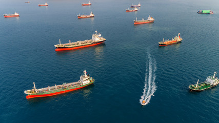 Aerial view Oil ship tanker park in the sea wait for unload oil to refinery.