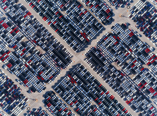 Aerial top view car park at sea port or manufacture waiting for logistics ,shipping or export to worldwide.