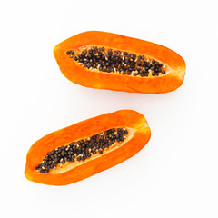 Slice of tasty papaya on white background. Flat lay. Top view. Fruit concept