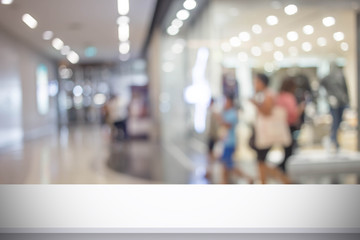 Abstract blur image of People walking at shopping mall or exhibition hall with bokeh for background usage .