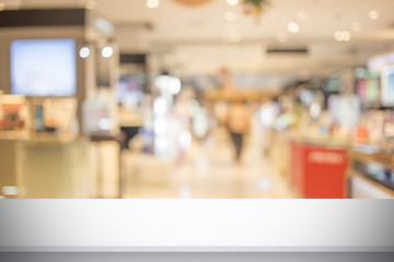 Abstract blur image of People walking at shopping mall or exhibition hall with bokeh for background usage .