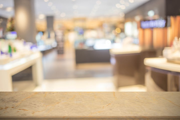 Abstract blur image of People walking at shopping mall or exhibition hall with bokeh for background usage .