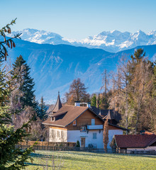 Fototapeta na wymiar dyllic winter landscape in Soprabolzano, Trentino Alto Adige, northern Italy.