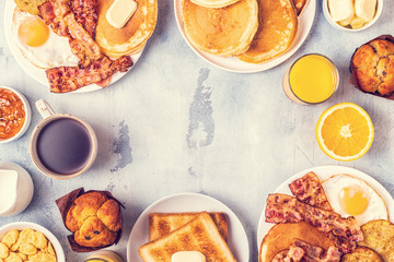Healthy Full American Breakfast with Eggs Bacon Pancakes and Latkes.