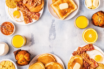 Fototapeta na wymiar Healthy Full American Breakfast with Eggs Bacon Pancakes and Latkes.