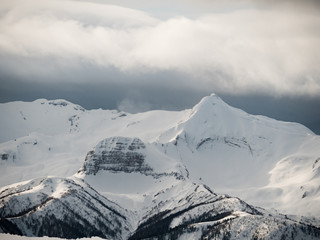 caucasus mountains high mountain peaks covered with snow and with clouds at winter day