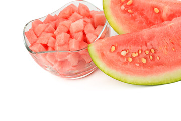 Sliced appetizing watermelon and dessert in a vase isolated on white background.