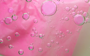 water drops bokeh background, pink color background,