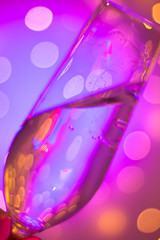 Champagne glass in disco party bar