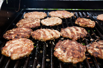 Homemade delicious minced meat steaks on grill