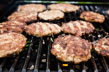 Homemade delicious minced meat steaks on grill