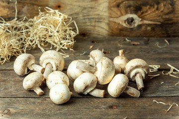 natural, organic mushrooms on a wooden, rustic kitchen table