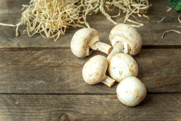 natural, organic mushrooms on a wooden, rustic kitchen table