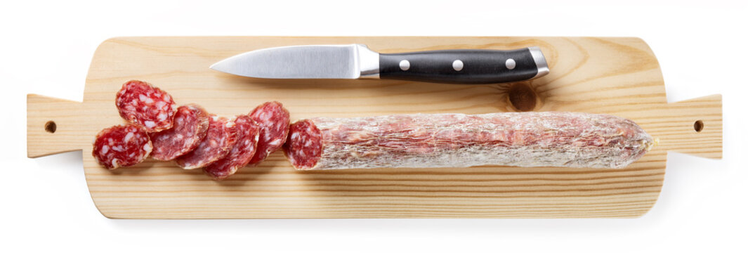 Sliced salami on white background, top view