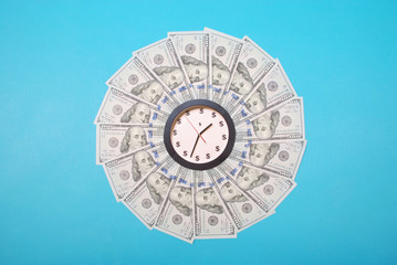 Concept of clock and dollar. Clock on mandala kaleidoscope from money. Abstract money background...