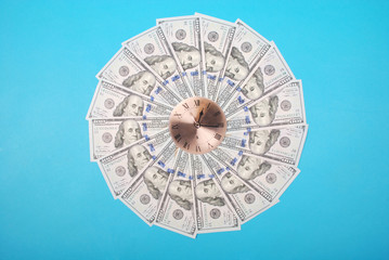Concept of clock and dollar. Clock on mandala kaleidoscope from money. Abstract money background...