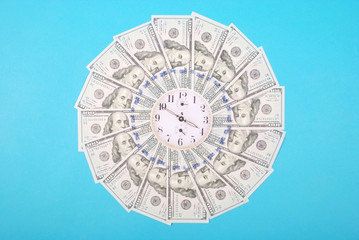 Concept of clock and dollar. Clock on mandala kaleidoscope from money. Abstract money background...