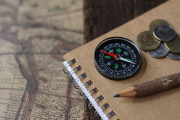 Vintage tone compass, coin, key and map, antique travel concept