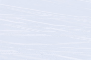 Traces of intersecting arcs of automobile tires in fresh snow