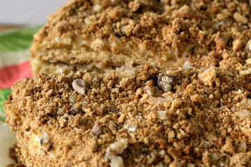 Sweet tasty cake sprinkled with nuts