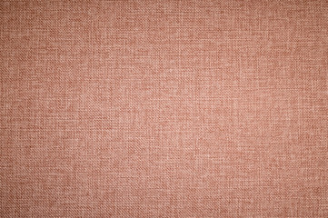Textured background surface of textile upholstery furniture close-up. burlap brown color fabric structure