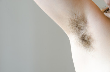 hairy woman's armpit, close-up, unshaven, a lot of hair on the armpit - obrazy, fototapety, plakaty