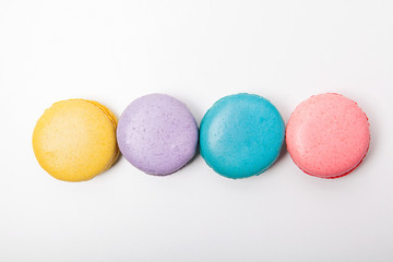 Sweet and colourful macaroons or macaron on white background.