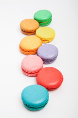 Sweet and colourful macaroons or macaron on white background.