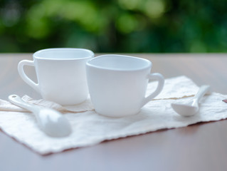 White ceramic cups on table