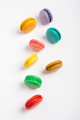 Obraz premium Sweet and colourful macaroons or macaron on white background.