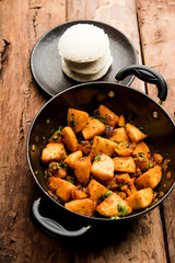 Masala fried Idlies or Idli fry - south indian Snack made using with leftover idly served with tomato ketchup. selective focus