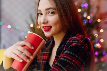 Woman Drink Her Hot Coffee While Sitting In Cafe. Portrait Of Stylish Smiling Woman In Winter Clothes Drinking Hot Coffee. Female Winter Style. - Image