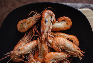 Cooked shrimp in black plate
