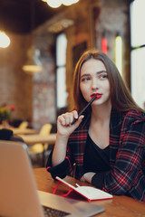 Woman Work In Cafe On Her Laptop. Portrait Of Stylish Smiling Woman In Winter Clothes And Work At Laptop. Female Winter Style. - Image